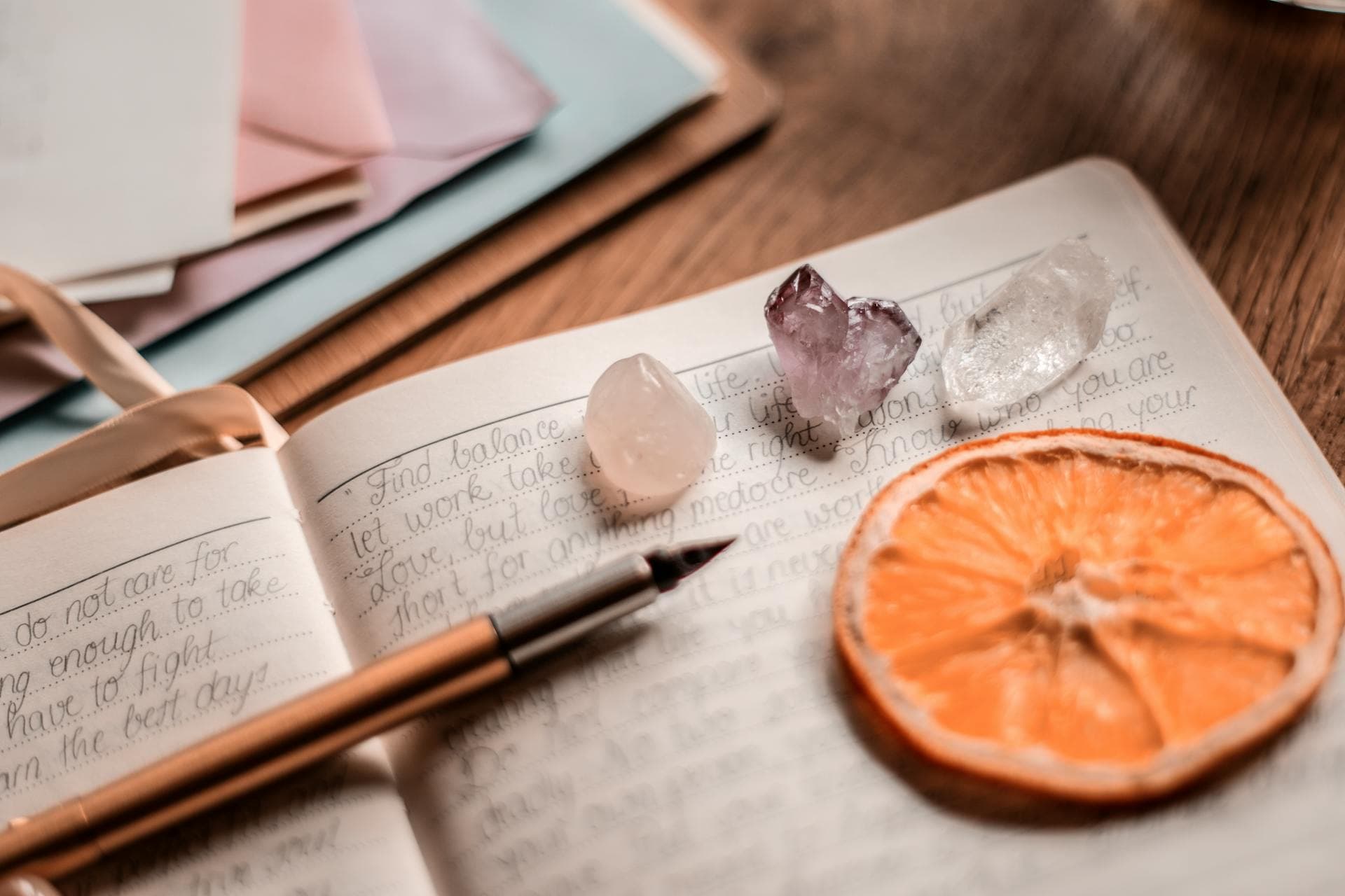 A table with a book and crystals