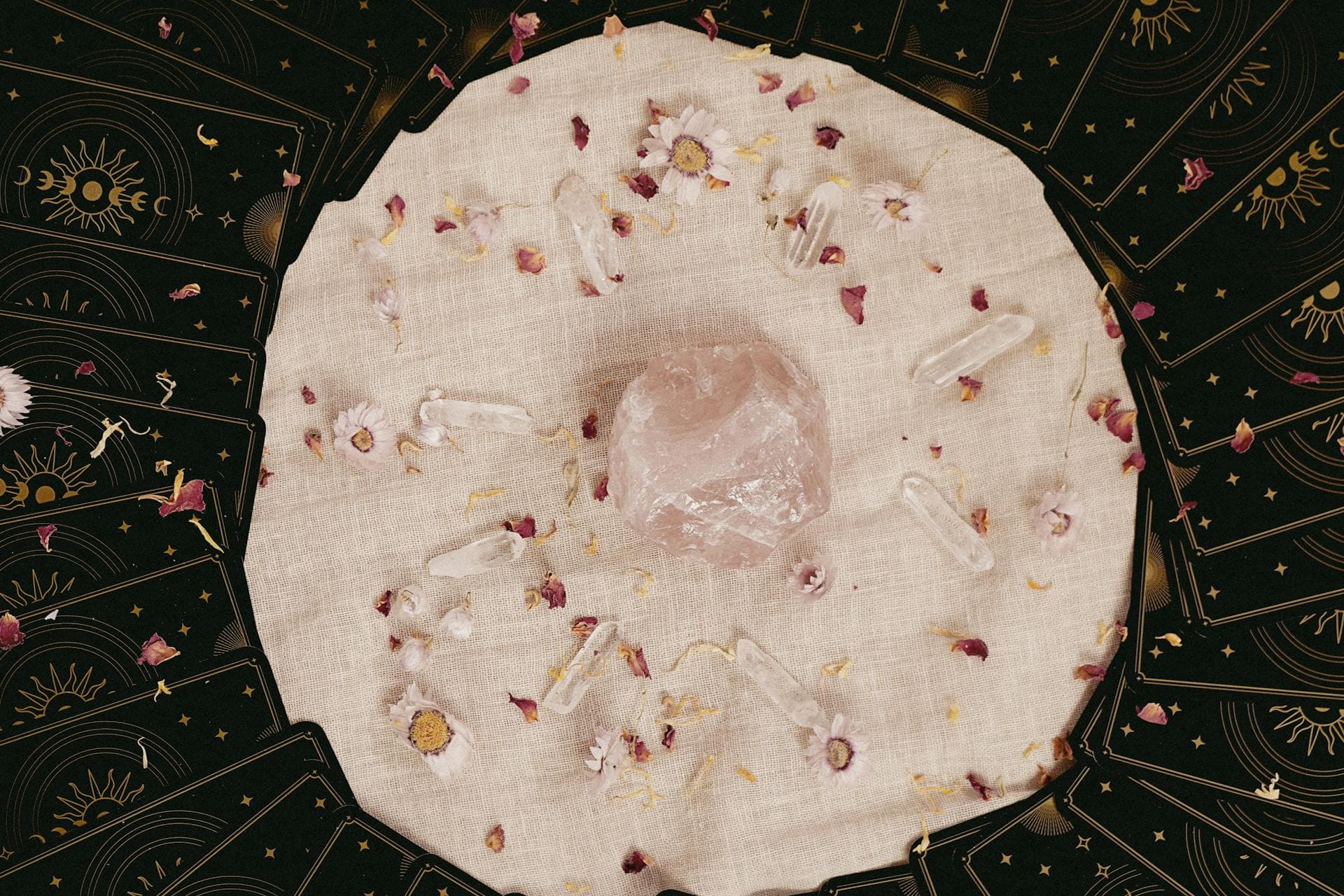 Close-up of a tarot spread with crystals