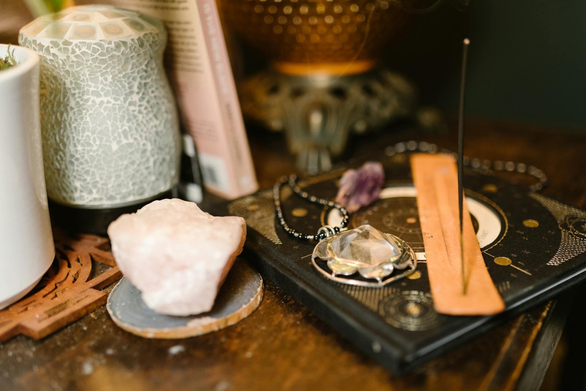 A table with incence and crystals