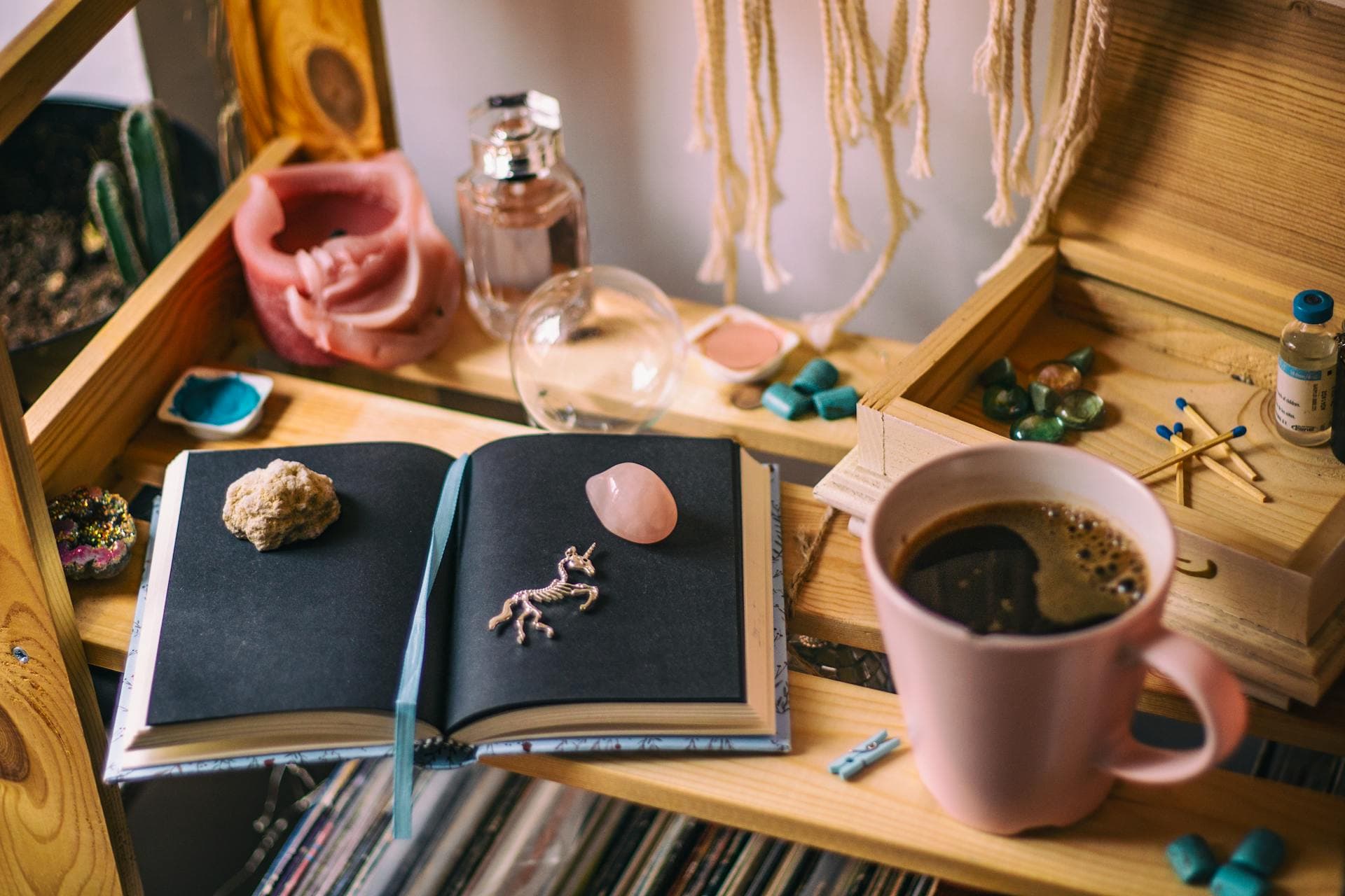 A table with coffee, books, matches and other oddments