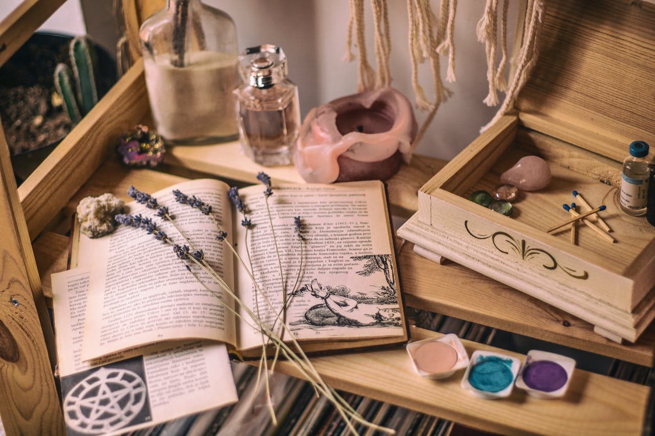A peaceful healing setup with candles and holistic tools.